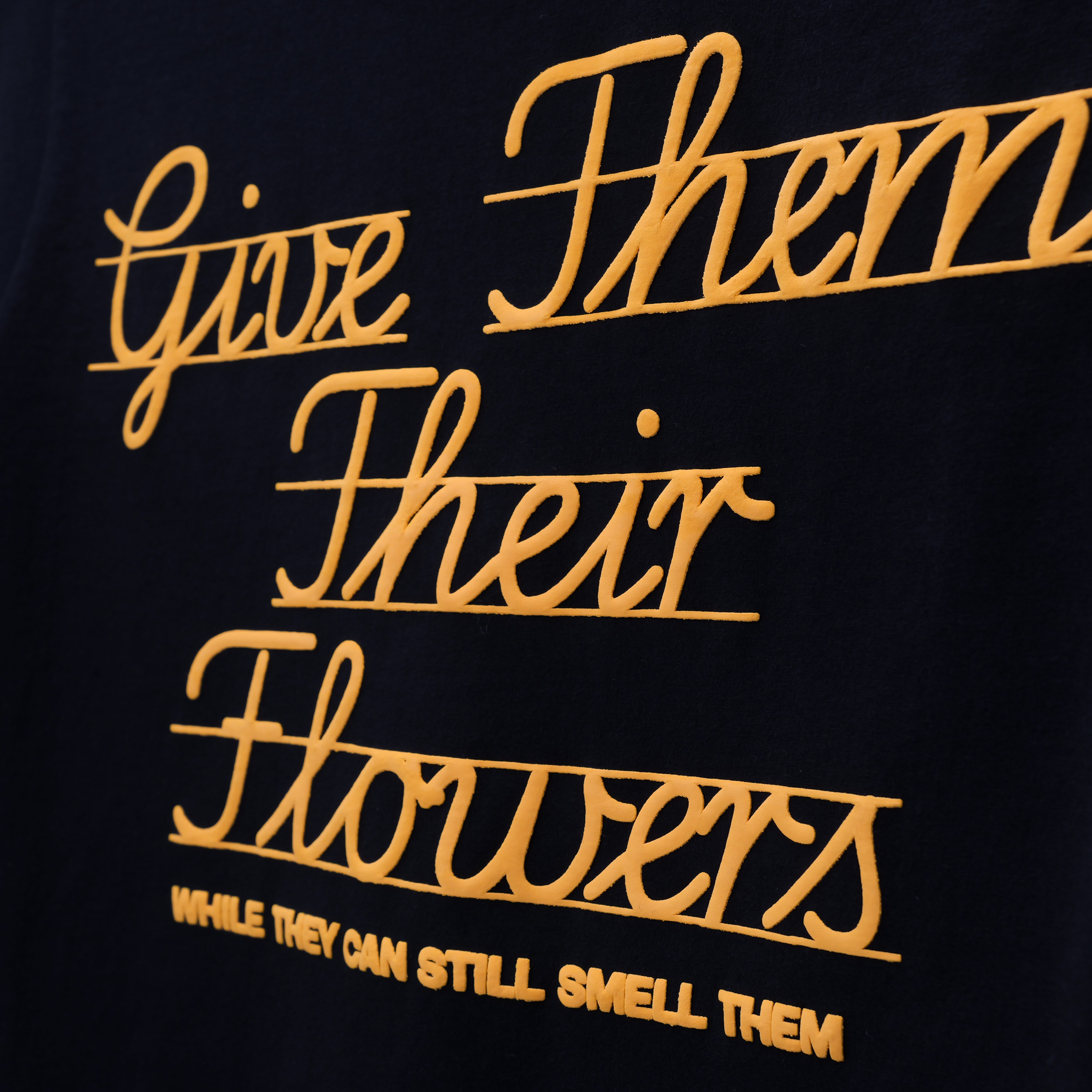 GIVE THEM THEIR FLOWERS SPELL OUT TEE BLACK